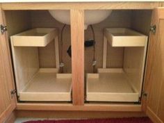 an image of two wooden cabinets in the bathroom