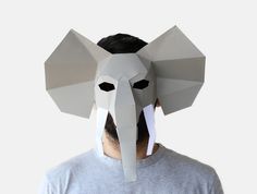 DIY low poly elephant Mask - DIY Paper Craft Project. Need a fancy dress costume? There's no need to wait! Stunning low Poly Masks or paper Masks are here! Instantly download, print and make this awesome DIY low poly paper mask right in your own home with our printable elephant mask pattern template! Making low Poly Masks is enjoyable, Tashkon helps you to have more cheerful. These plans and instructions enable you to make your own 3D elephant mask HALF MASK from the card. These digital template Origami Mask, Mask Papercraft, Elephant Mask, Diy Elephant, Low Poly Mask, Mask Paper, How To Build Steps, Scissors Crafts, Printable Masks