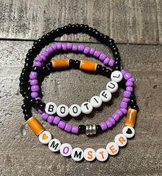 Listing includes stack of 3 Halloween themed bracelets shown in the photo.  -BOOTIFUL -MOMSTER  -Purple, black and silver accent  -Handmade with sturdy, quality elastic.  These bracelets make PERFECT GIFTS for anyone special! Sizes are estimates. Please measure your wrist and leave 1/2 of leeway/ give. Standard bracelet size is 6.75 in to 7 in.  All orders are FINAL SALE. Care should be used to avoid unnecessary over-stretching. Do not expose bracelets to water or leave out in direct sunlight. Bracelet Diy, Halloween Bracelet, Purple Halloween, Black Bracelets, Bracelets Handmade Beaded, Silver Accents, Bracelet Crafts, Spirit Halloween, Bracelet Stack