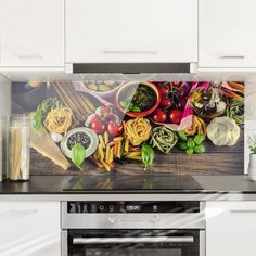 a kitchen scene with focus on the oven and counter top, which has an image of pasta