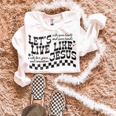 a white t - shirt that says let's live like jesus and checkered shoes