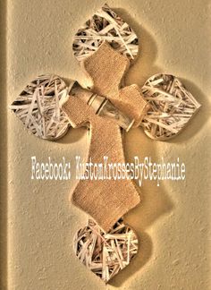 an image of a cross made out of paper and burlocked with yarn