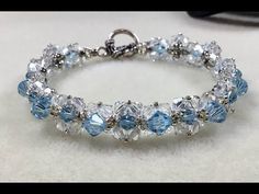 a bracelet with blue and clear stones on it