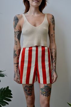 Fifties/Sixties Red &White Striped Shorts. Metal Zipper in Back With Button Closure. Unlined. Two Hip Pockets. No Content Label No Size Tag Great/Good Vintage Condition - Small Marks, Unfinished Edges On Inside, Belt Loop Needs Reinforcing. Handmade? Seam Imperfections All Measurements Taken Flat Waist-10.5" Hips-19" Rise-14" Inseam-4.5" All Sales Are Final. We have taken the time to note all size measurements and the condition of each piece so please look over all the information of the garment Retro Red Shorts For Summer, Retro Red Shorts, Vintage Red Shorts For Summer, Red Vintage Summer Shorts, Vintage Red Summer Bottoms, Red Vintage Summer Bottoms, Red And White Stripes, Metal Zipper, Striped Shorts