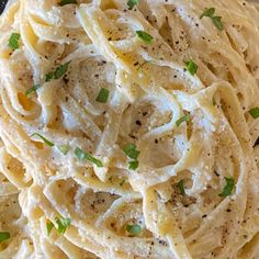 pasta with parmesan cheese and chives on a plate