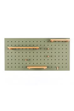 a peg board with two wooden handles and some holes on it