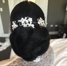 the back of a woman's head wearing a tiara