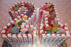 two boxes filled with gummy bears sitting on top of a table