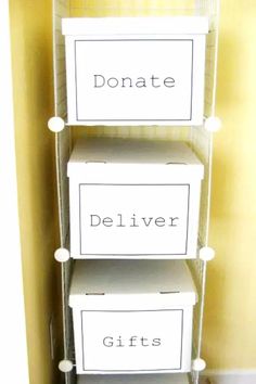 three white boxes are stacked on top of each other and labeled with the words donations