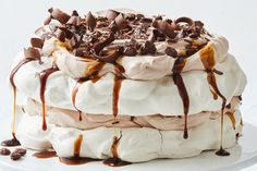 a cake covered in chocolate and marshmallows on top of a white plate