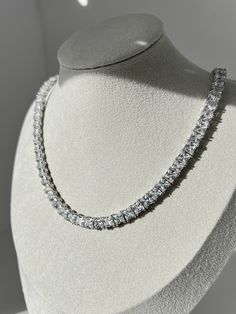 Stunningly elegant and crafted with precision, this tennis necklace of solid sterling silver features rows of dazzling created diamonds for a luxurious, timeless look. With a total carat weight ranging from 55.38TCW (depends on the length), this necklace is perfect for any special occasion or everyday wear. This exquisite necklace has high polished rhodium finish that gives it a stunning shiny look that lasts for many years. Our created diamonds and gemstones are synthetic simulants (NOT natural Diamond Chains, Pretty Jewelry Necklaces, Silver Chain For Men, Chain For Men, Diamond Simulant, Expensive Jewelry, Tennis Necklace, Diamonds And Gold, Pretty Gift