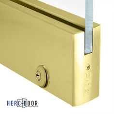 an image of a gold door handle with glass on the top and bottom part that has a blue stick sticking out of it