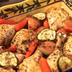 chicken, carrots and cucumbers in a casserole dish with herbs