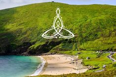 an image of a beautiful beach with green hills in the background