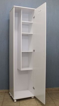 an empty white cabinet with shelves on the side