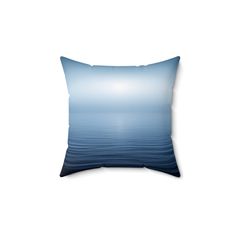 a blue pillow with an ocean scene on it