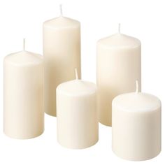 five white candles are lined up against a white background