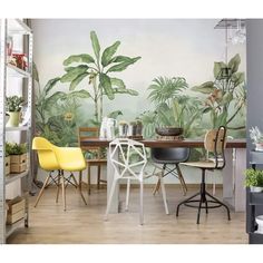 a dining room table with chairs and plants on the wall