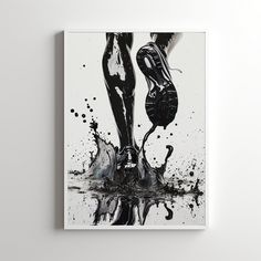 a black and white photo of a person's feet with water splashing on them