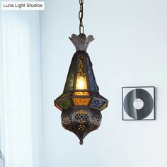 a lamp hanging from the ceiling in a room