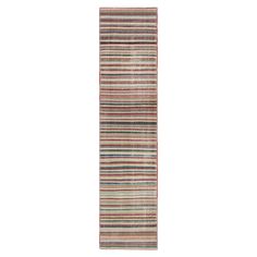 a multicolored striped rug on a white background