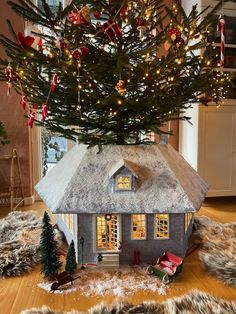 a christmas tree in the shape of a house