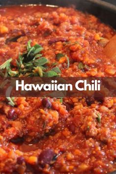 a pan filled with food and the words hawaiian chili on it in front of an image of