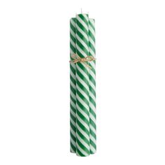 two green and white striped candles tied with twine