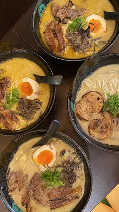 four bowls filled with different types of food