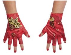 two hands wearing red gloves with gold designs on them