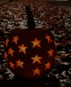 a pumpkin with stars carved into it