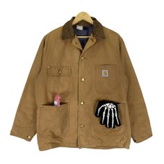 PLEASE ASK ANY QUESTION BEFORE BUYING THIS IS USED CLOTHING PLEASE DONT EXPECTED IT TO BE LIKE NEW OR IN PRISTINE CONDITION CARHARTT CHORE WORKWEAR BUTTON JACKET tag Carhartt material Cotton 100% saiz on tag M (Medium) Mesasures About ( Approximately) -Armpit to Ampit : update inch -Length (back collar down) : updated inch Condition : used good condition 8/10 **No Tears No Stains And No Hole** 🎈PLEASE READ THE DESCRIPTION AND POLICY BEFORE BUYING 🎈ACCEPT PAYMENT: PAYPAL ONLY ALL ITEM WILL BE S Canvas Jacket, Duck Canvas, Chore Jacket, Button Jacket, Brown Colour, Jacket Buttons, Used Clothing, Brown Color, Military Jacket