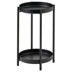 a black round table with two shelves on the bottom and one shelf in the middle