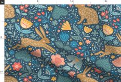 an image of a fabric with rabbits and flowers in blue, pink, yellow and orange colors