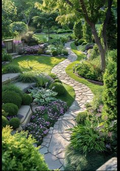 a stone path in the middle of a garden