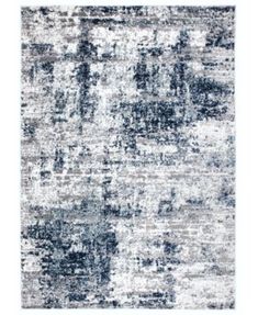 an area rug with gray and white colors on it, in the shape of a rectangle