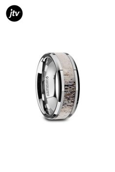 the men's wedding band is made with deer antelope inlay