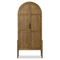 an arched wooden cabinet with two doors