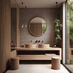 a bathroom with two sinks and a large round mirror above the sink, along with stools