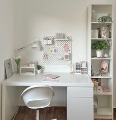 a white desk and chair in a room