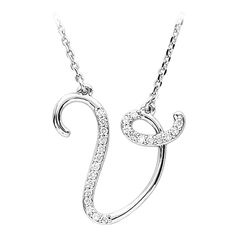 Express your individuality with a beautiful, 14k white gold script initial necklace. Each letter V is approximately 17.5mm (5/8 inch) in width by 17mm (5/8 inch) in length and includes an attached 1mm width, 17-inch long diamond-cut solid cable link chain with a lobster claw clasp. Pinpoint set with 24 full-cut, G-H color, I1 clarity natural diamonds totaling 1/8 carat. Initial V, V Necklace, Script Initial, Diamond Initial Necklace, Silver Diamond Necklace, Initial Pendant Necklace, Bow Jewelry, Letter V, Initial Pendant