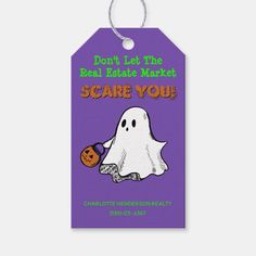 a purple halloween gift tag with a ghost holding a pumpkin and the words don't let the real trick scare you