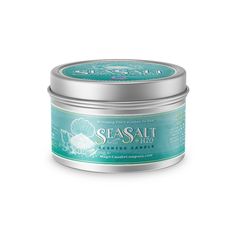 sea salt body scrub in a tin on a white background