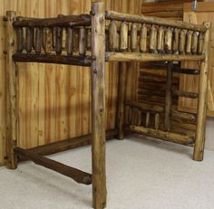 a wooden bunk bed sitting in a bedroom next to a wall with wood slats on it