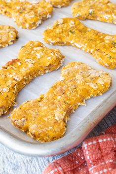 some food is laying out on a baking sheet and ready to be cooked in the oven