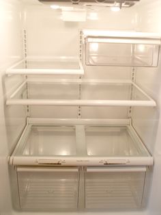 an empty refrigerator with the door open and no ice maker in it's place