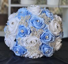 a bridal bouquet with blue and white flowers