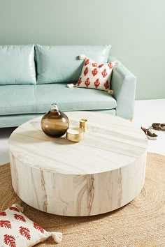 a living room with a blue couch and coffee table