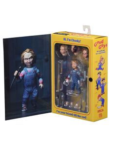 an action figure set in a box with the doll's head and hands on it