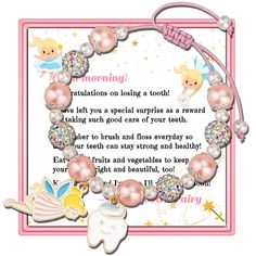 a pink and white bracelet with angel charms on it's side, saying good morning